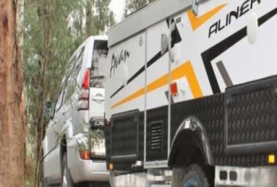side view of caravan and 4WD