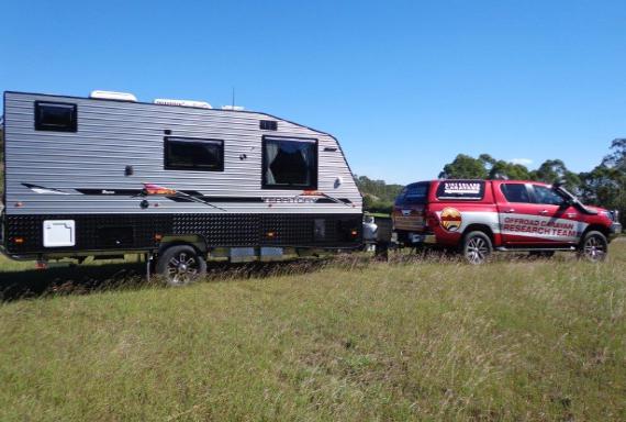 4WD and caravan in a field