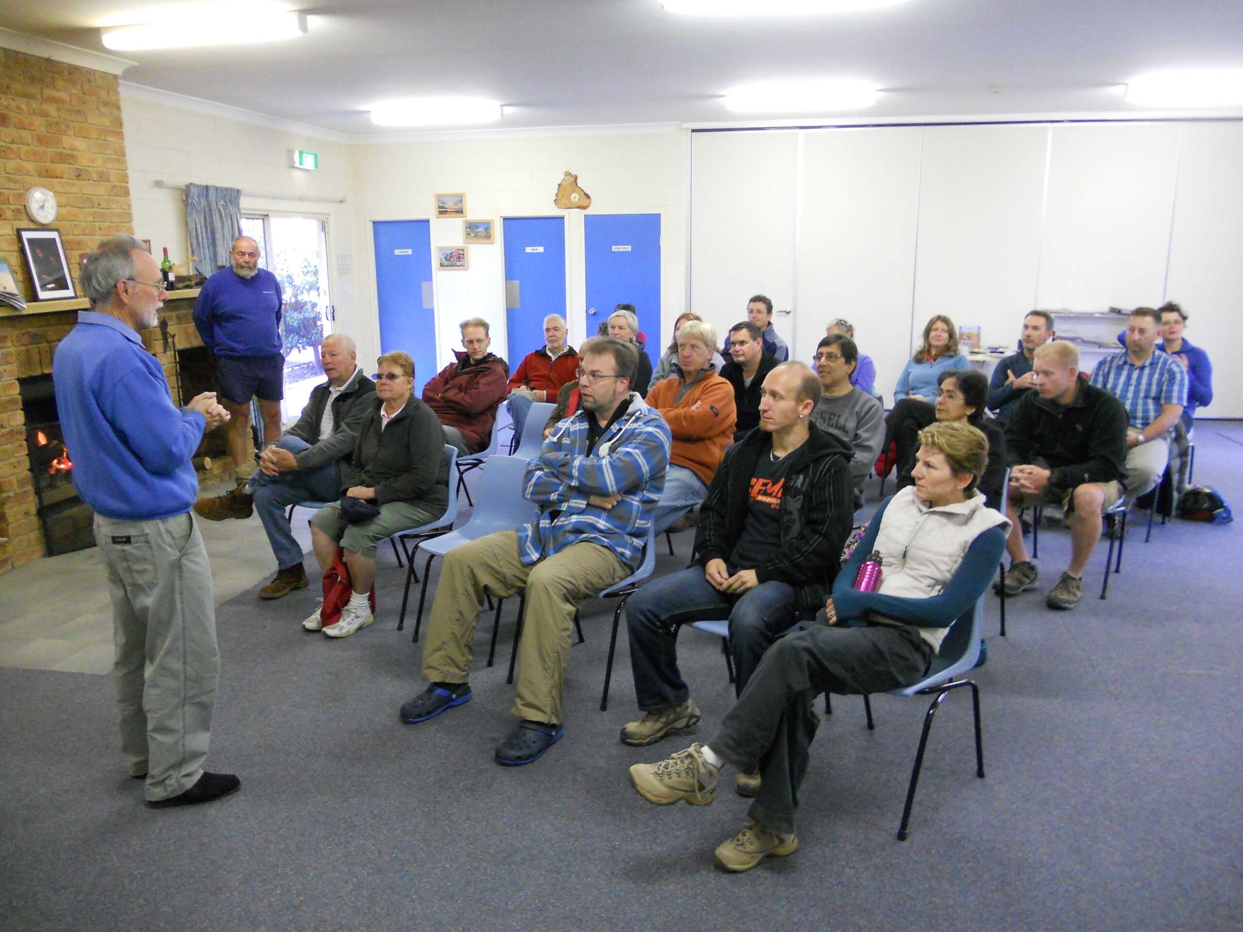 man giving a talk to a group of people
