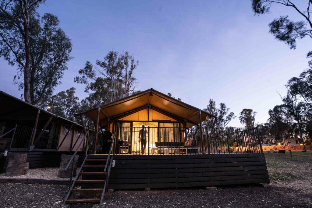 safari tents at night from the outside