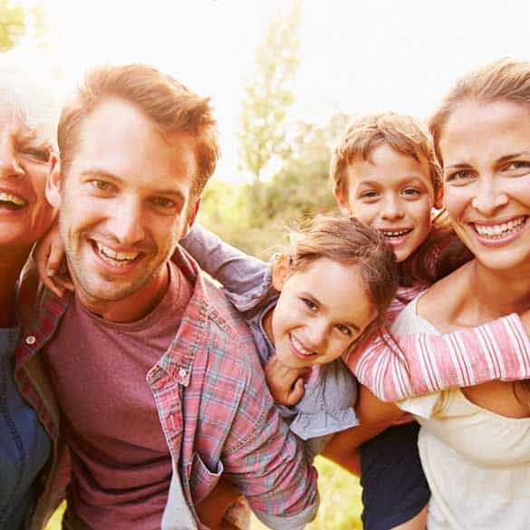 young coupe with children and older woman