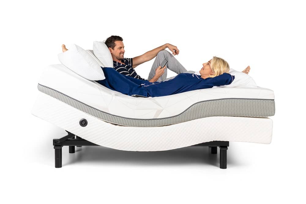 woman and man laying on mattress