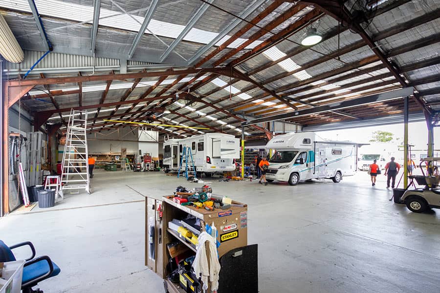 Repair shot of vans being fixed