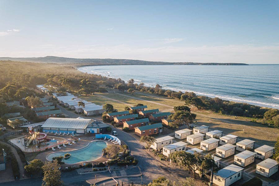 Aerial view of Discovery Parks - Pambula Beach on a sunny day